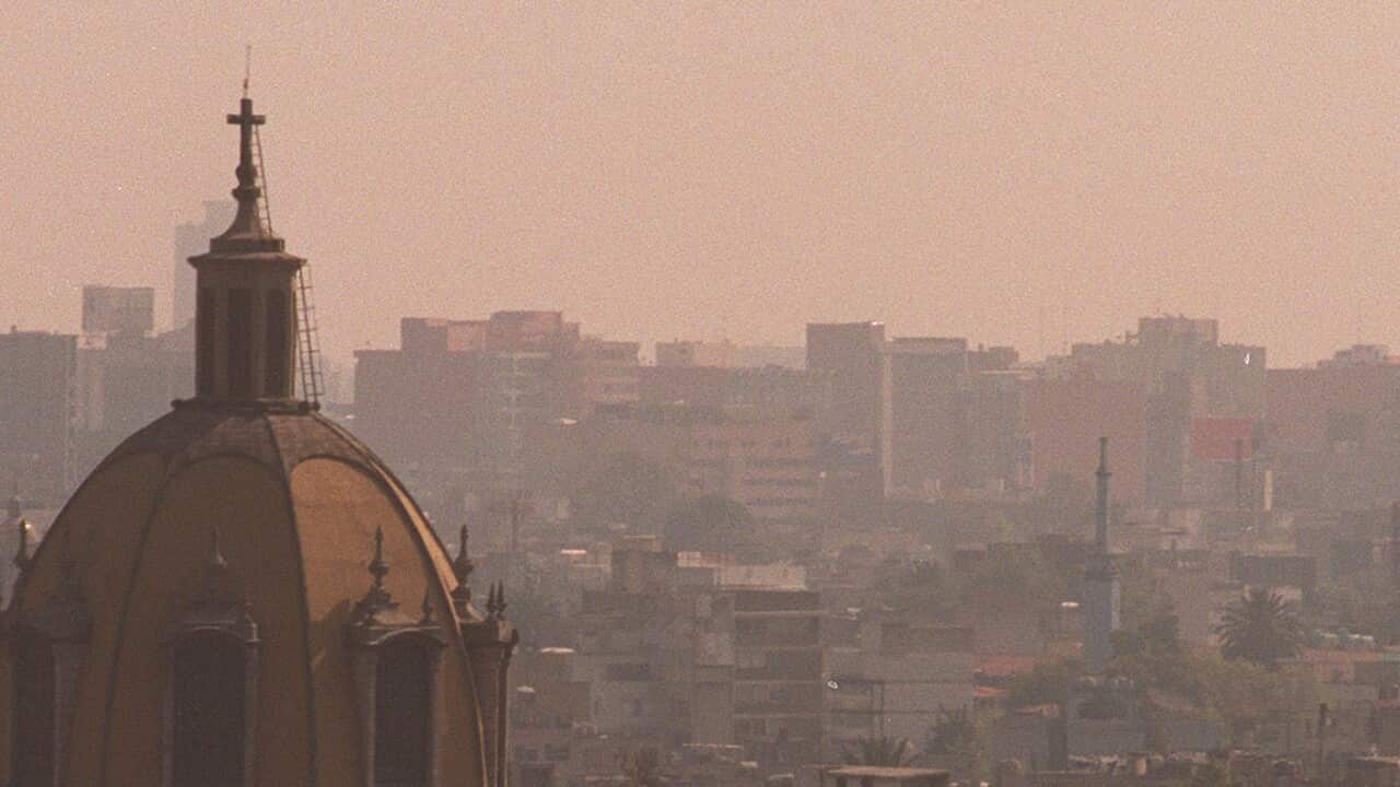A curtain of smog envelopes Mexico City.