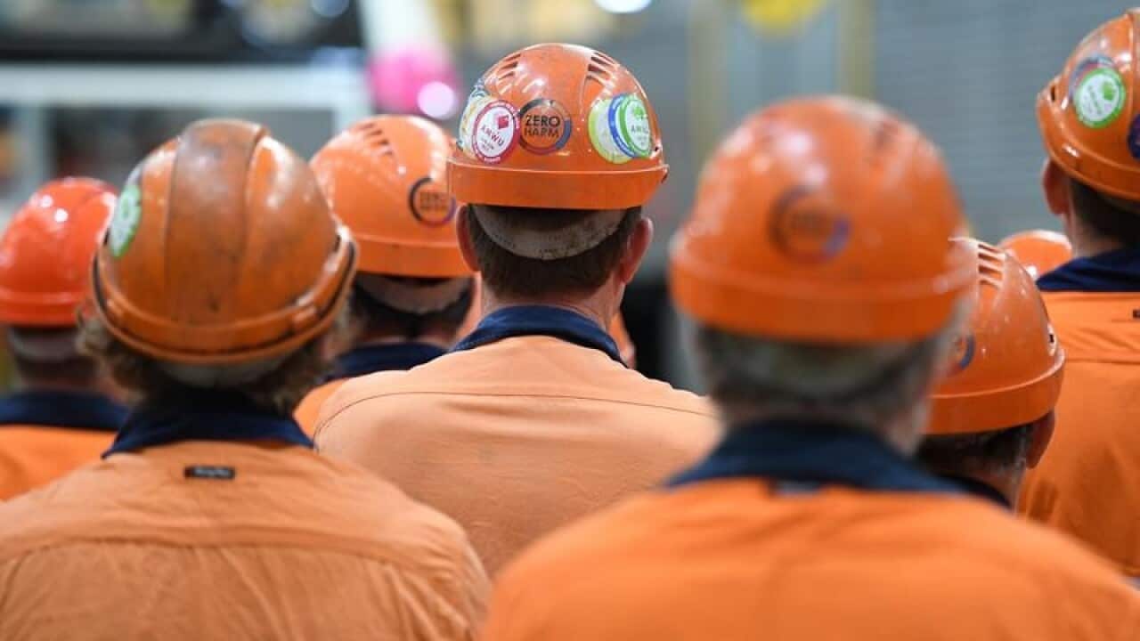 Workers gather in a factory in Maryborough, Queensland.