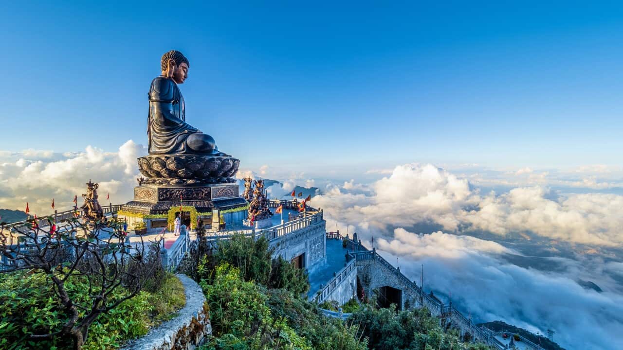 Landscape with Giant Buddha statue on the top of mount Fansipan