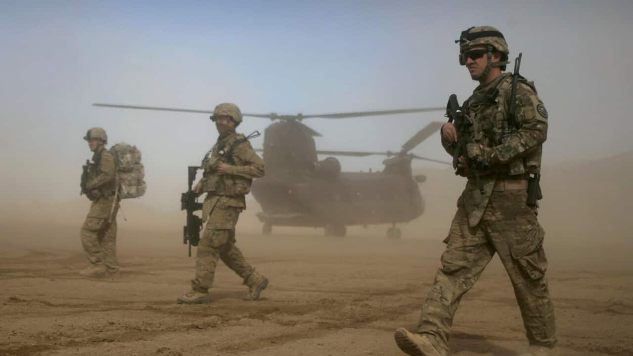 U.S. soldiers, part of the NATO- led International Security Assistance Force (ISAF) walk west of Kabul, Afghanistan.