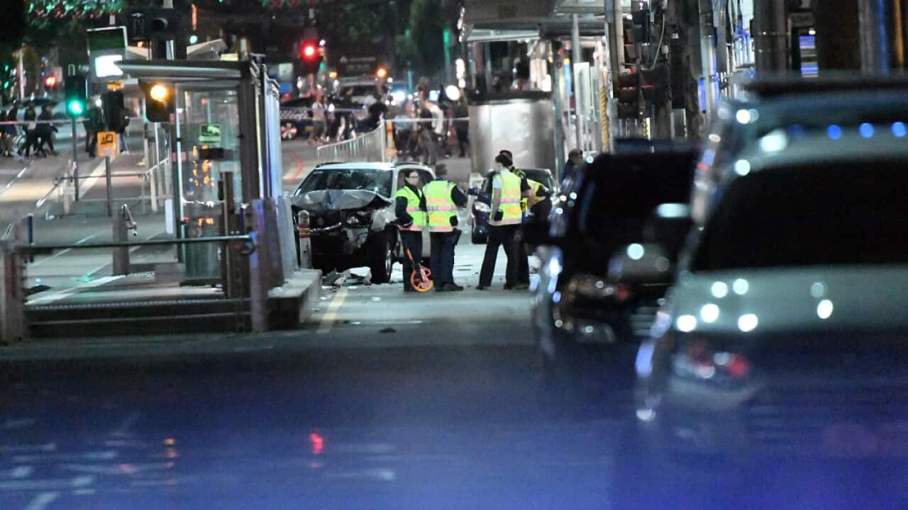 A damaged vehicle is seen at the scene of an incident on Flinders Street, in Melbourne, Thursday, December 21, 2017.