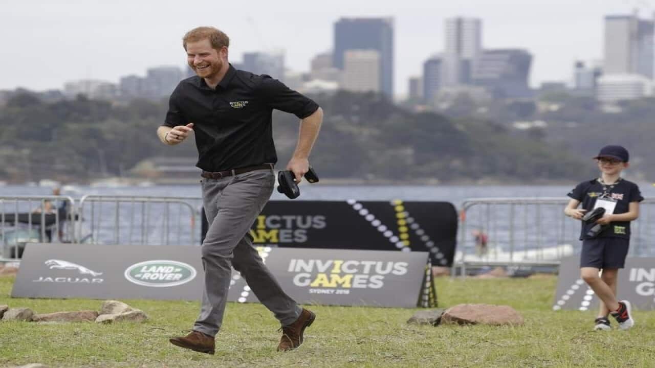Harry runs towards a remote control car on Cockatoo Island.