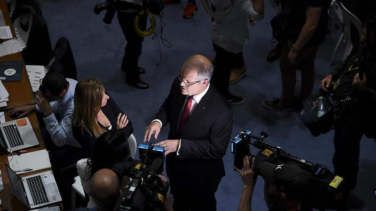 Australian Federal Treasurer Scott Morrison speaks to journalists as he visits the 2017 Budget Lockup at Parliament House in Canberra, Tuesday, May 9, 2017. Mr Morrison today handed down his second budget. (AAP Image/Lukas Coch) NO ARCHIVING