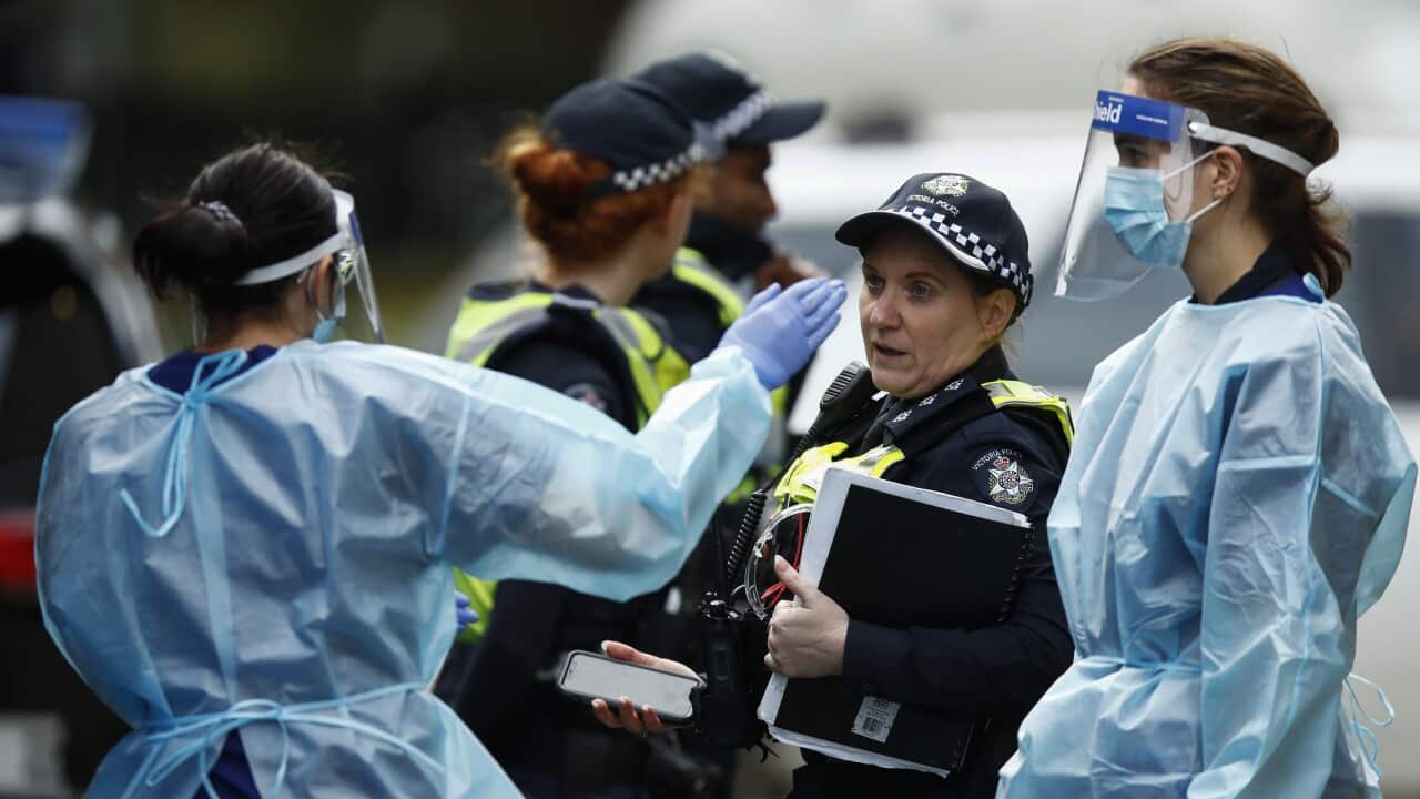 COVID-19 testing staff arrive at one of the public housing towers on Racecourse Road in Flemington, Melbourne, Sunday, 5 July, 2020.