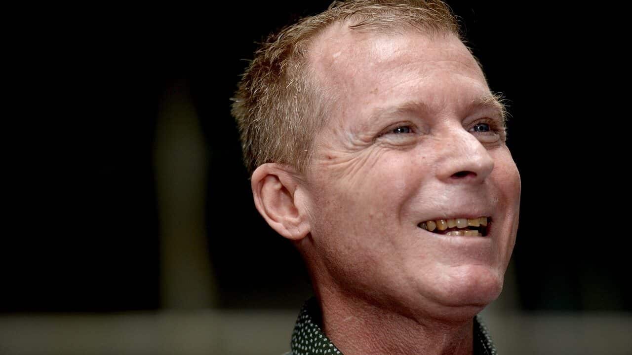 Australian academic Timothy Weeks speaks to the press on Sunday.