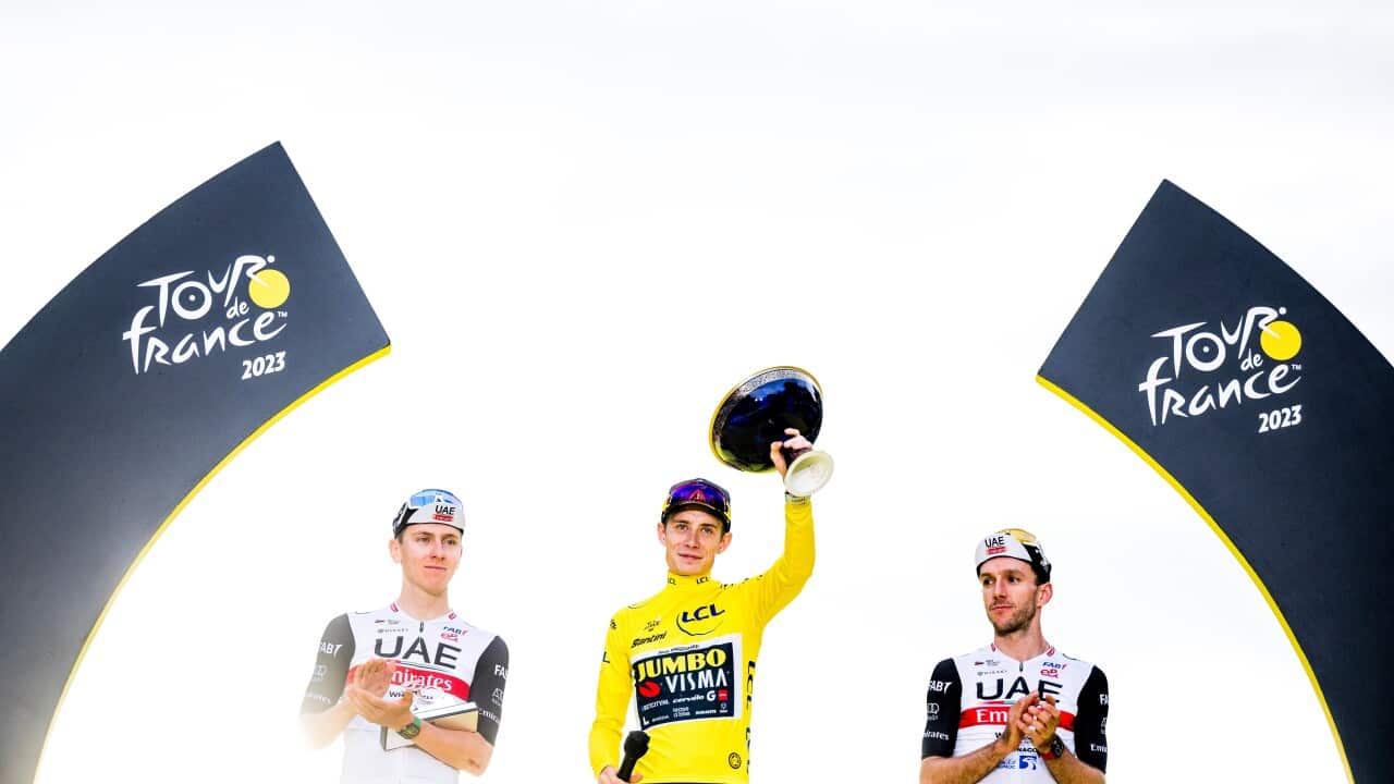 Slovenian Tadej Pogacar of UAE Team Emirates, Danish Jonas Vingegaard of Jumbo-Visma and British Adam Yates of UAE Team Emirates celebrate on the podium after the 21st and last stage of the Tour de France cycling race, from Saint-Quentin-en-Yvelines to Paris, France, Sunday 23 July 2023.