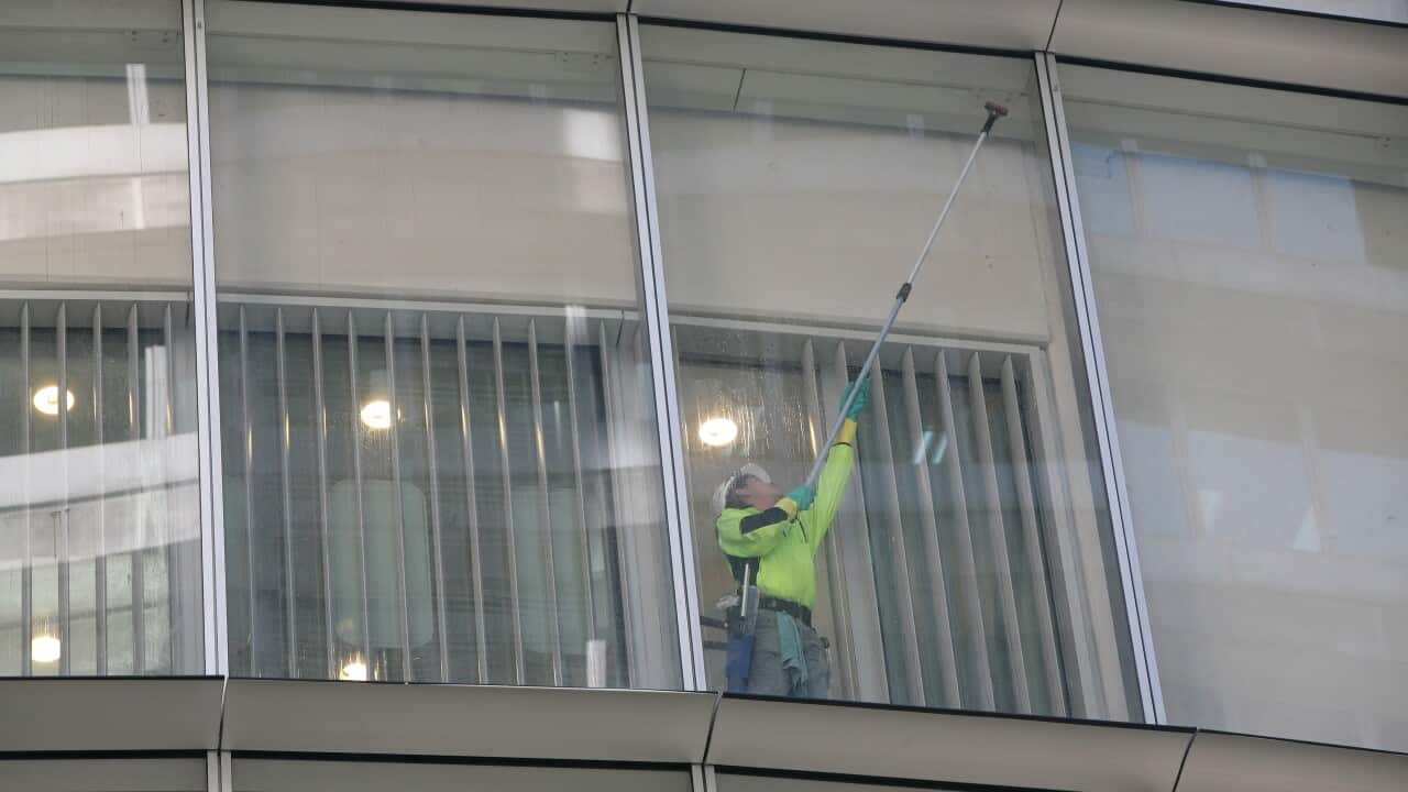 A man cleans the windows
