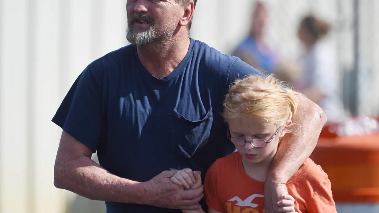 Joey Taylor walks with his daughter Josie Taylor after picking her up at Oakdale Baptist Church on Wednesday, Sept. 28, 2016, in Townville, S.C
