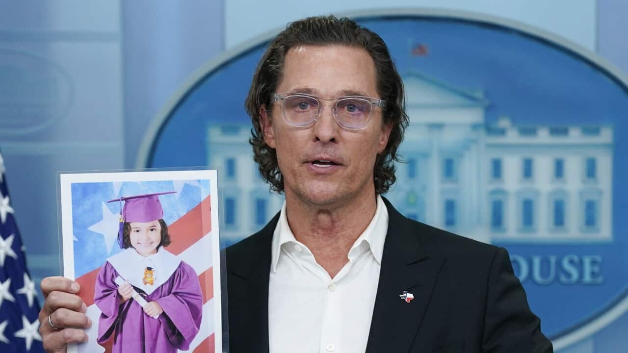 Actor Matthew McConaughey holding a picture