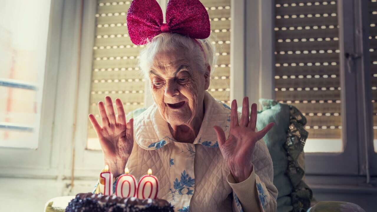 100 years old birthday cake to old woman elderly