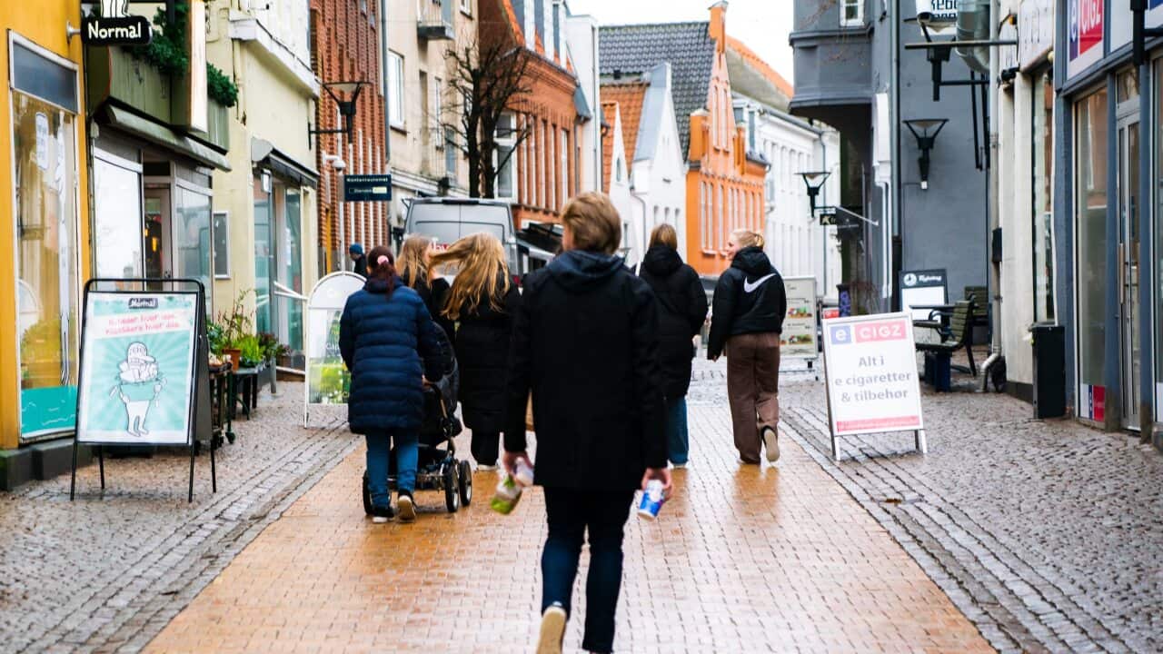 Young people stroll through Apenrade, Denmark.