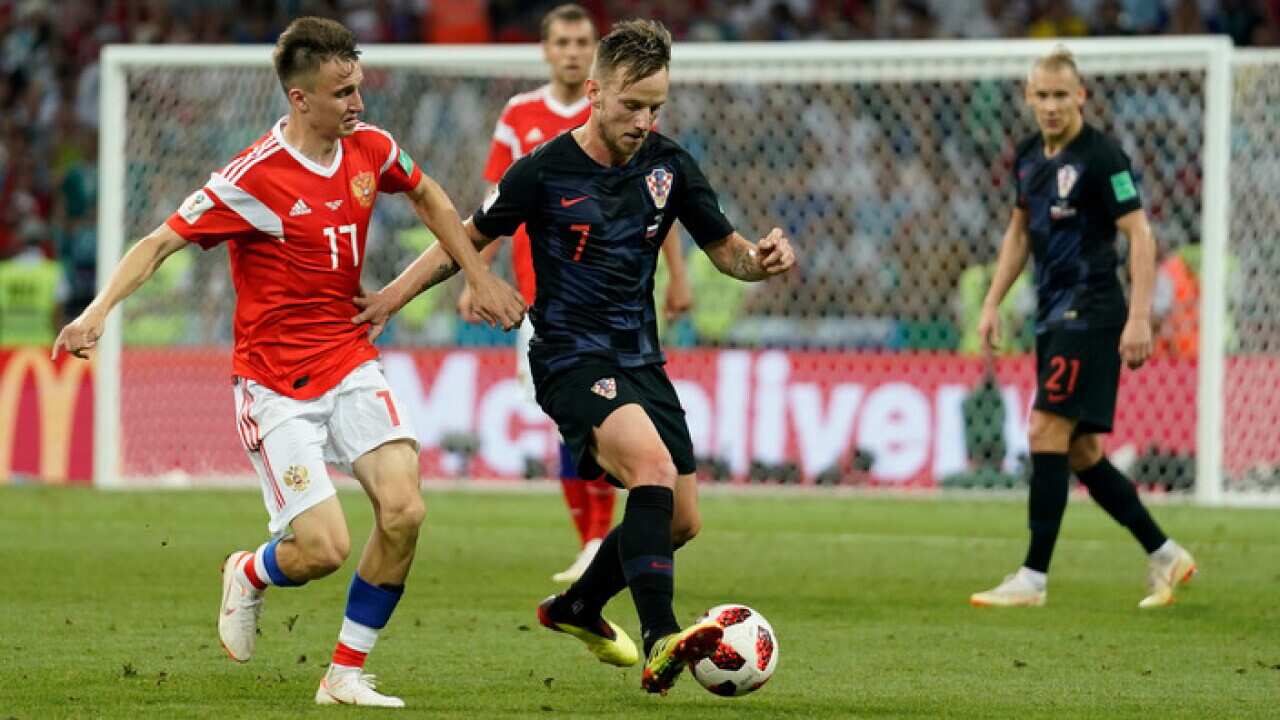 Image caption: Croatia's Ivan Rakitic on the ball in Croatia's quarter-final versus Russia.