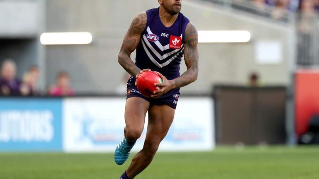Bradley Hill of the Dockers runs with the ball during the Round 23.
