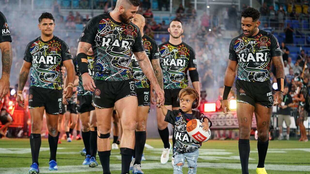 Quaden Bayles, (9), leads the Indigenous All Stars
