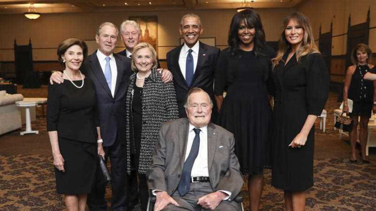 President George H.W. Bush, shows Bush, front center, and past presidents and first ladies Laura Bush, from left, George W. Bush, Bill Clinton, Hillary Clinton, Barack Obama, Michelle Obama and Melania Trump.