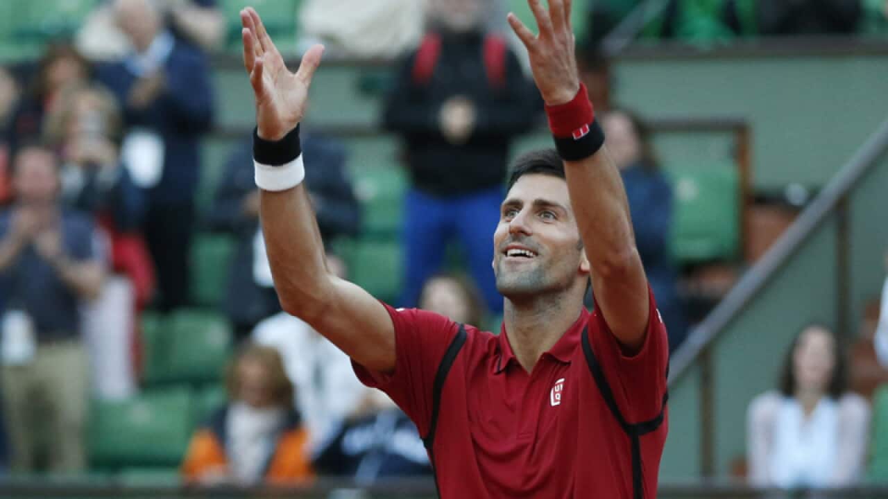 Serbia's Novak Djokovic celebrates winning