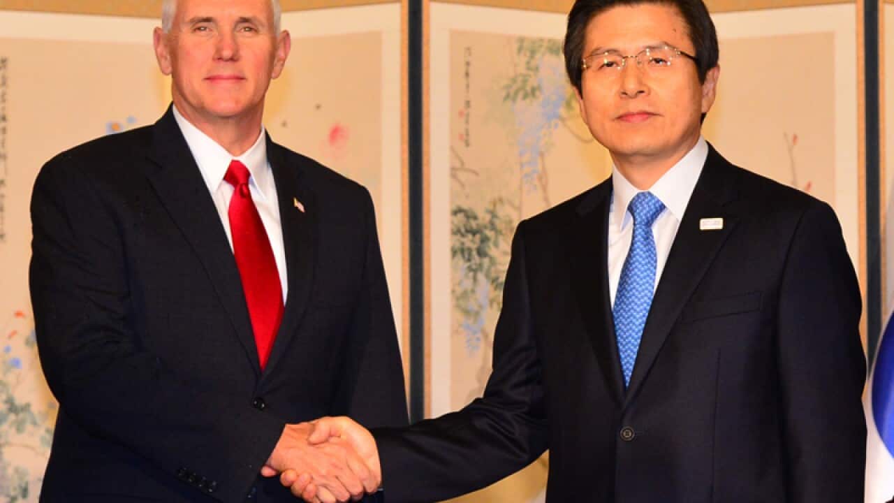 US Vice President Mike Pence (L) and South Korea's acting president