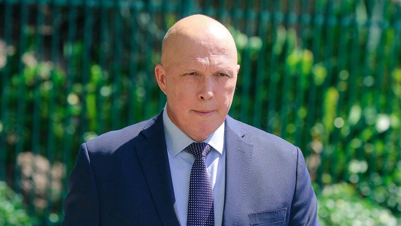 A man in a suit outside