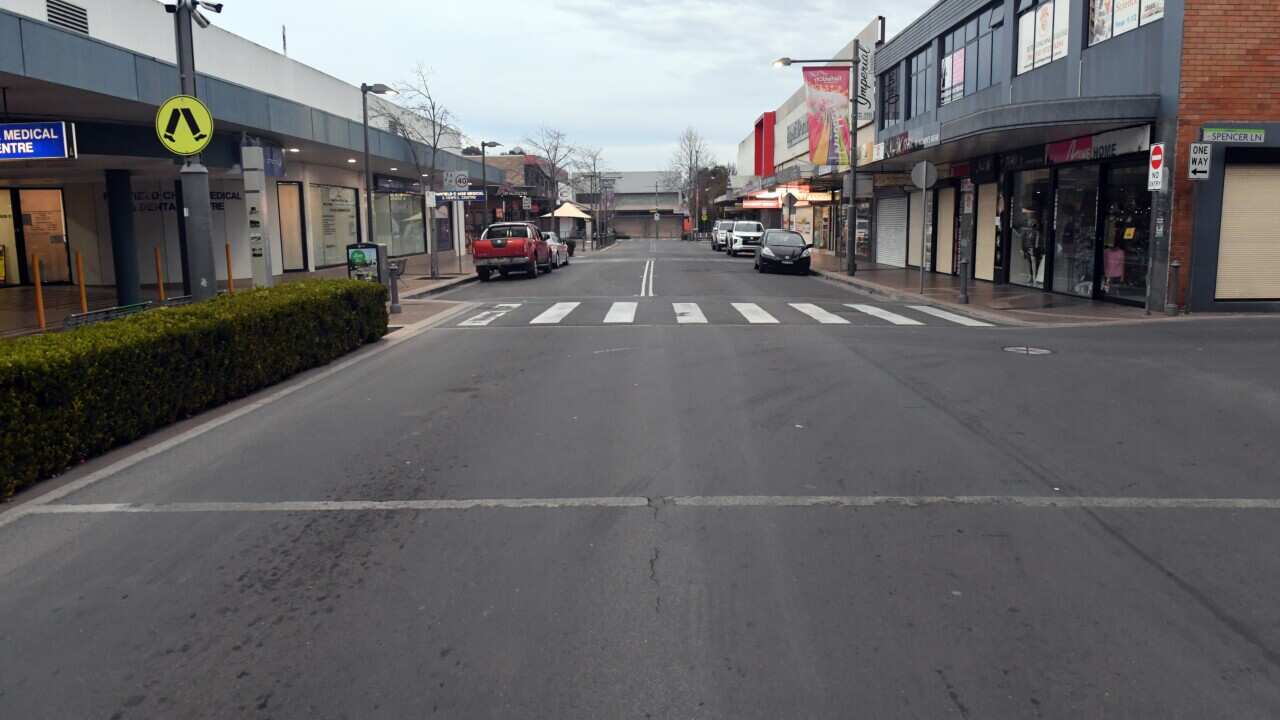 An empty street in the shopping district is seen in the southwestern suburb of Fairfield in Sydney