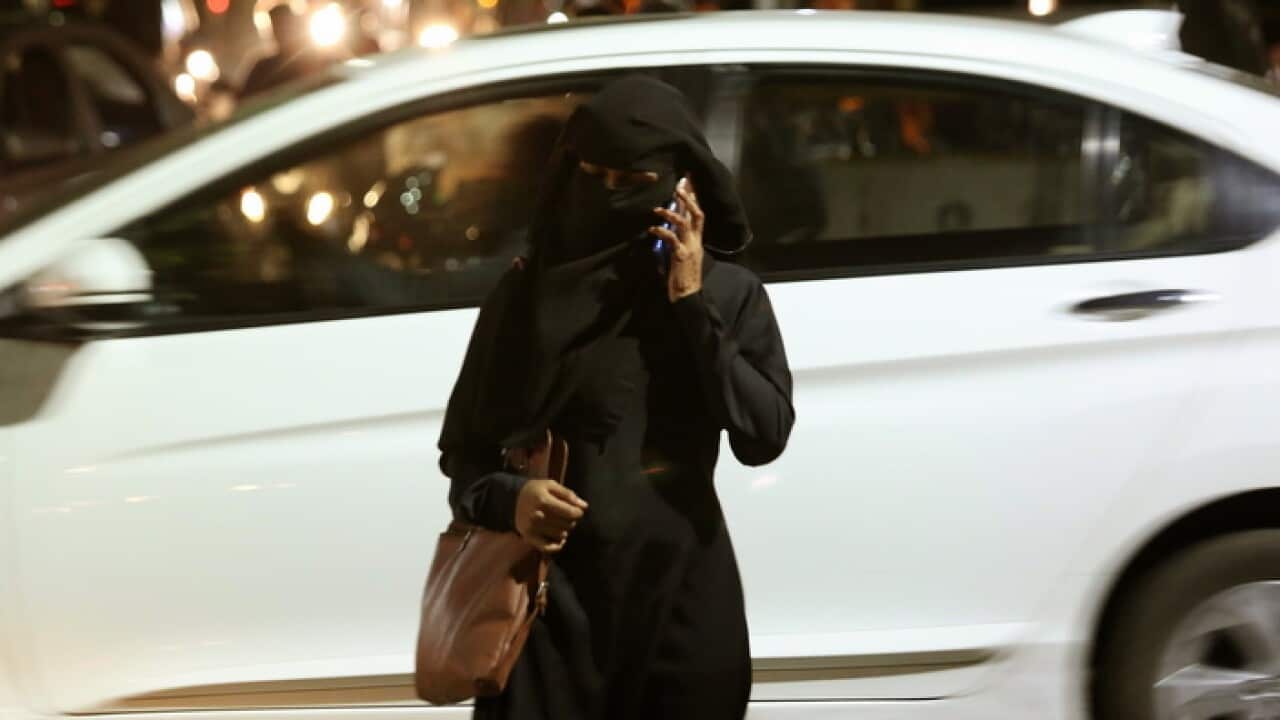 An Indian Muslim woman walking in Bangalore on the day the practice of triple talaq was outlawed