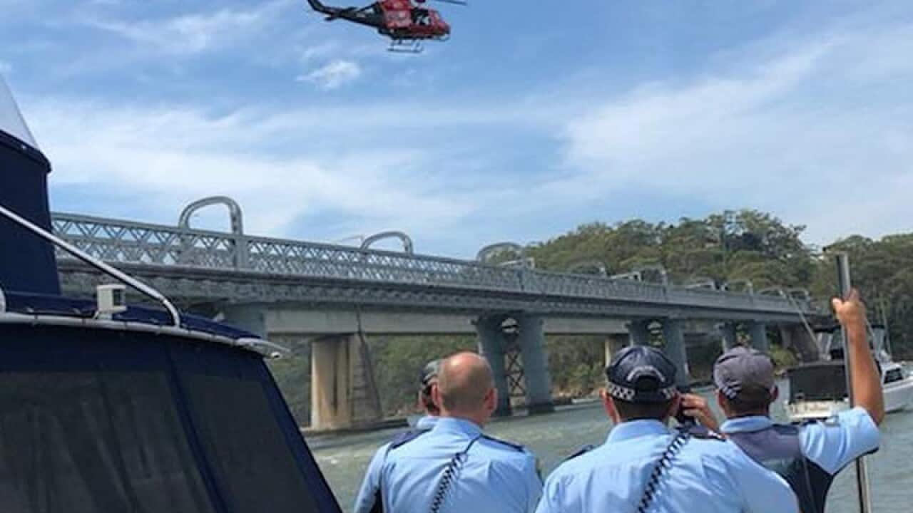 Rescue personal at the scene where a man jumped off the Como.