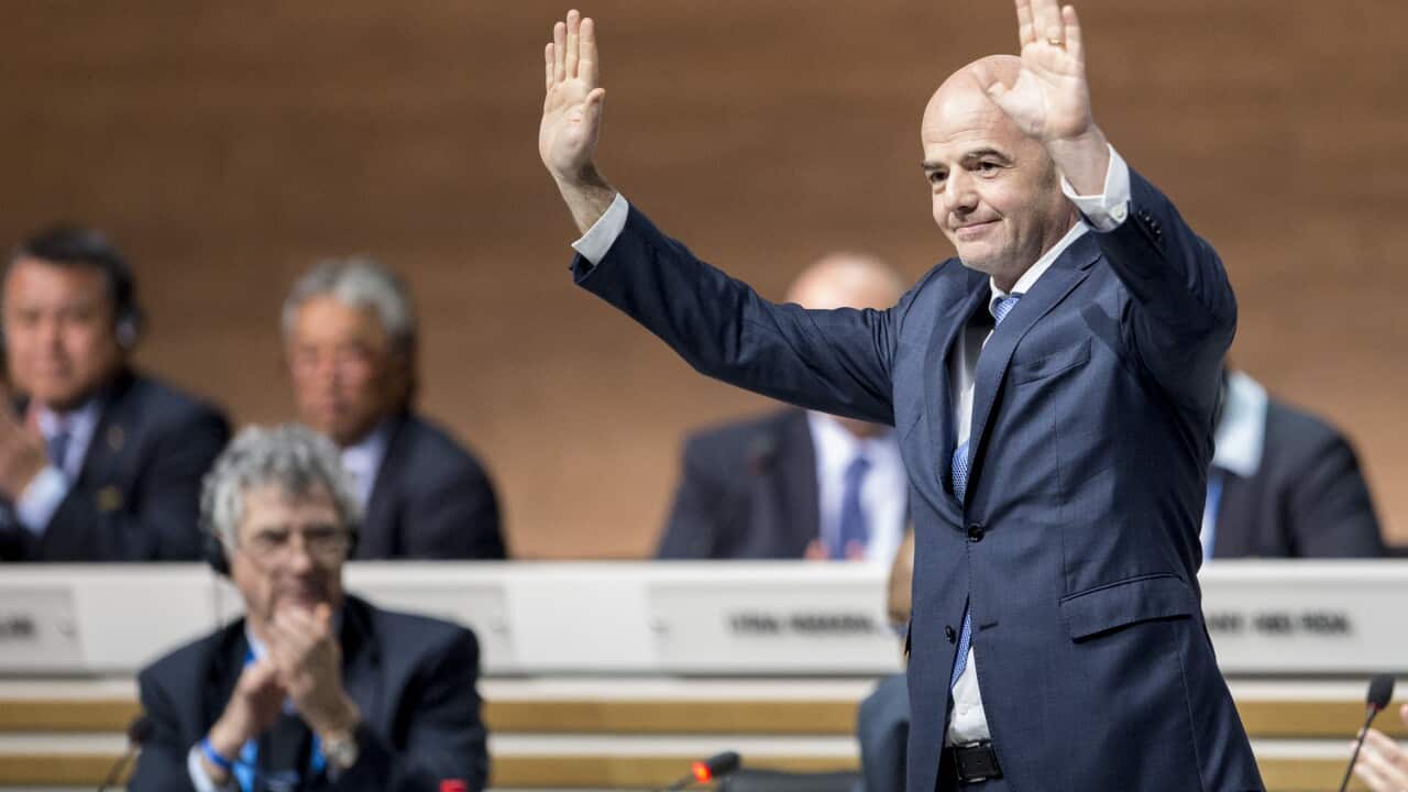 FIFA president Gianni Infantino waves to delegates after his election