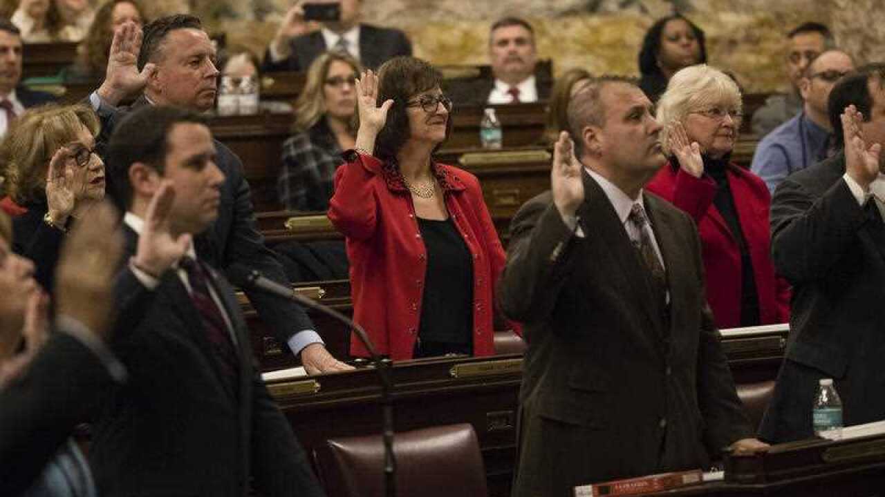 Electors including Patricia Poprik take an oath during Pennsylvania's 58th Electoral College at the state Capitol in Harrisburg, Pa., Monday, Dec. 19, 2016.