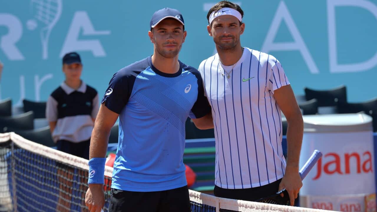 Grigor Dimitrov, right, poses for cameras with Croatia's Borna Coric during their semifinal match at a tournament in Zadar, Croatia