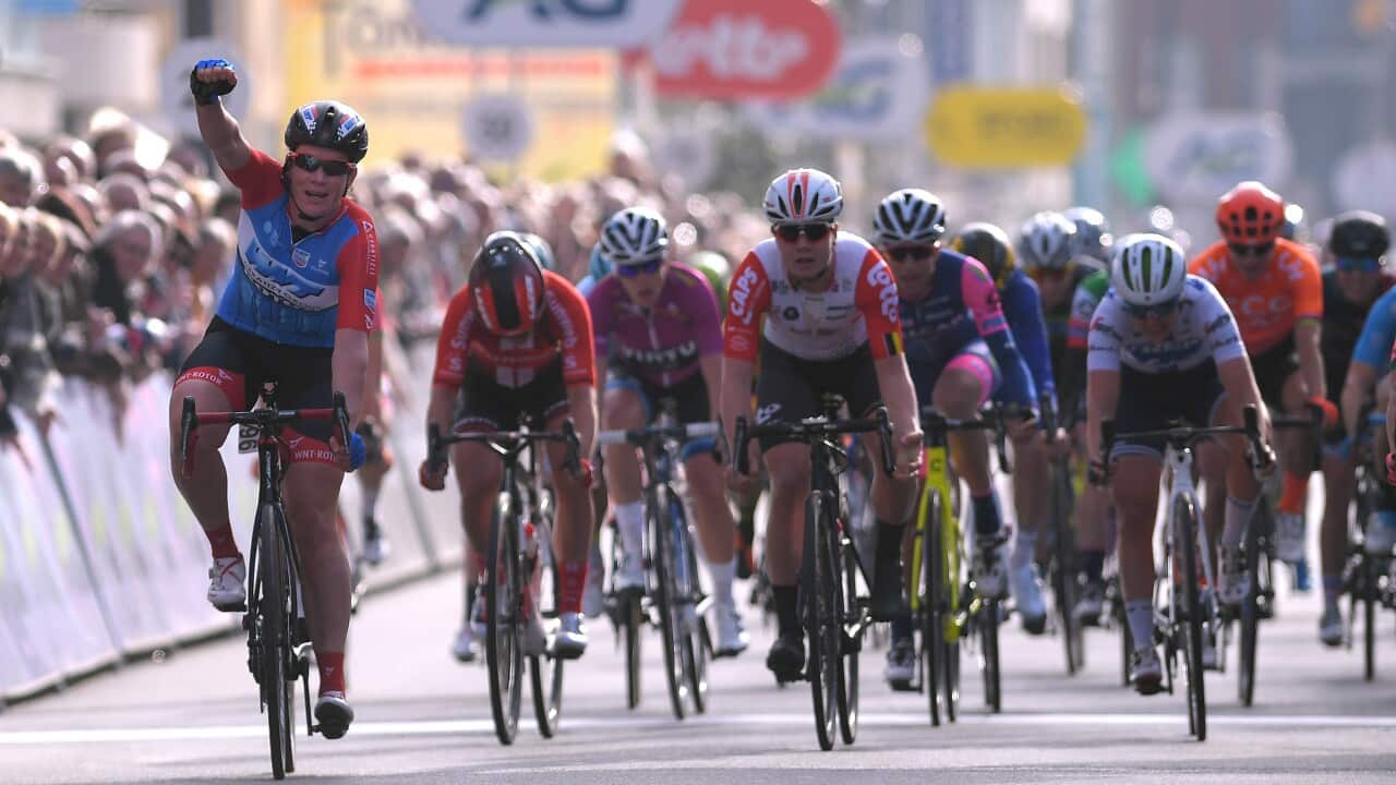 Kirsten Wild punches the air in celebration of winning the UCI Women's World Tour Driedaagse Brugge-De Panne (Getty)