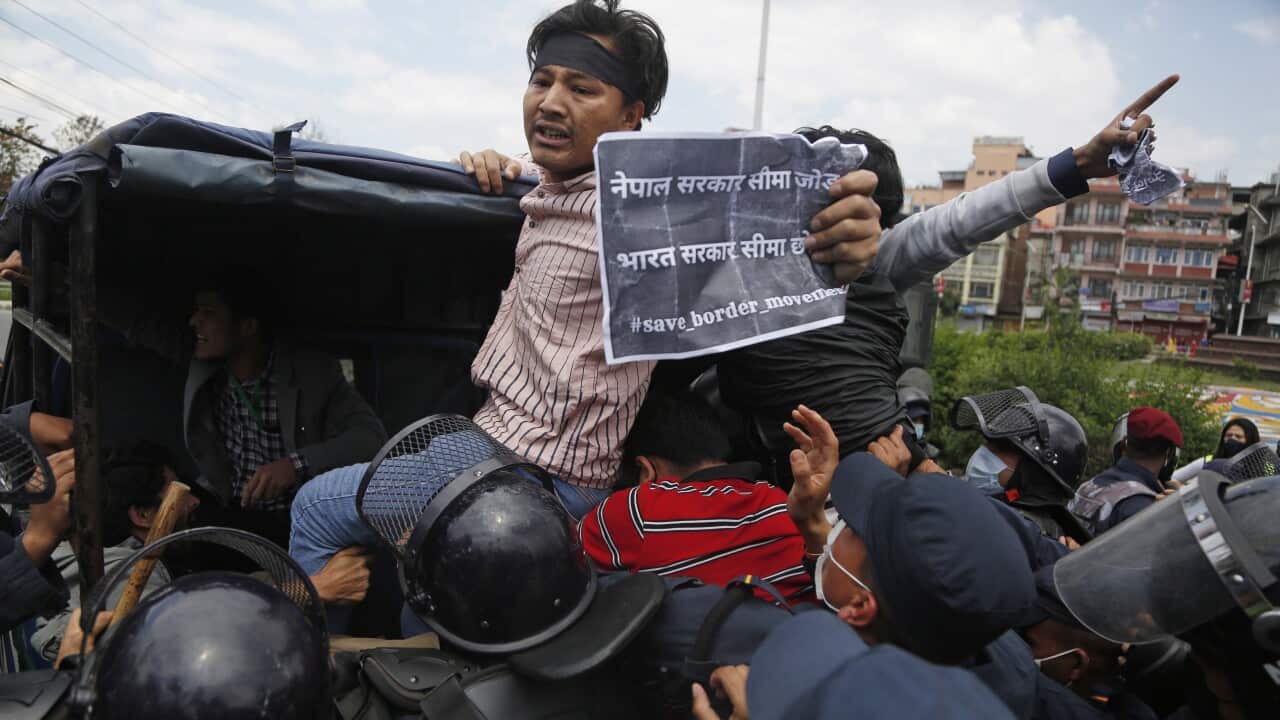 Nepalese students chants the slogans after being detained by police while protesting against the Indian government decision to build link road in disputed land.