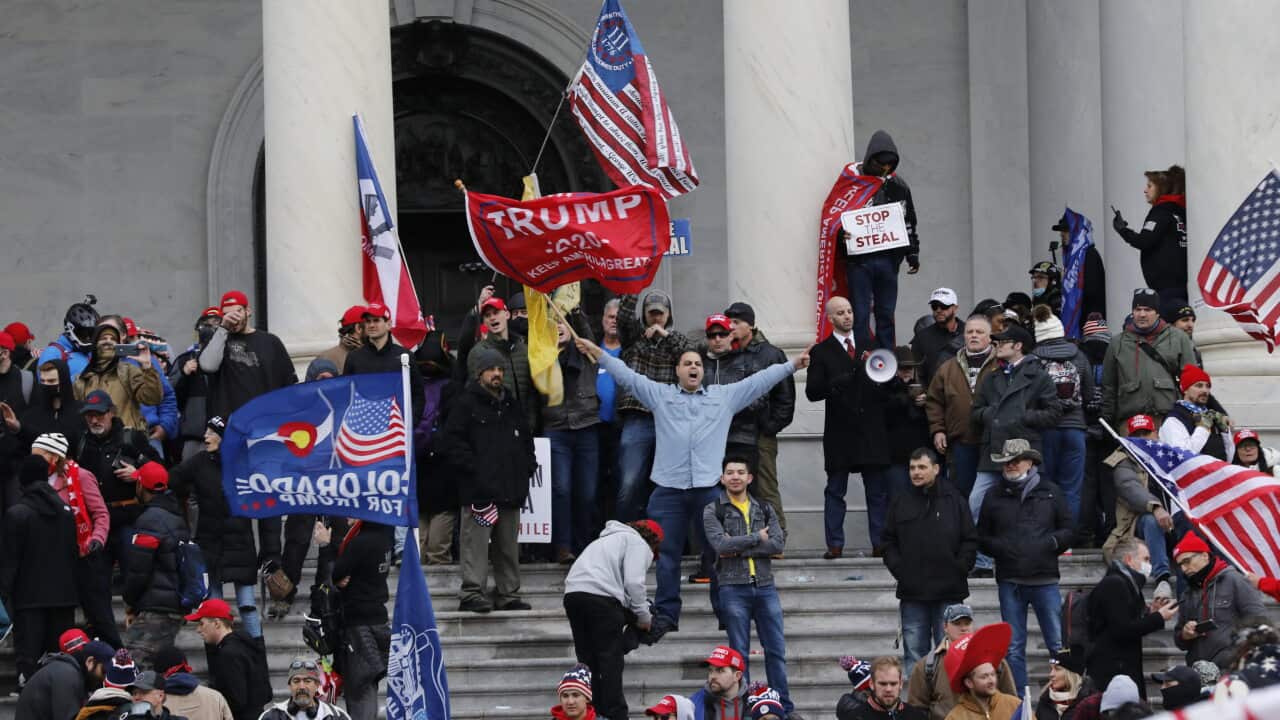 Trump supporters protest on the steps of U.S. Capitol in Washington.