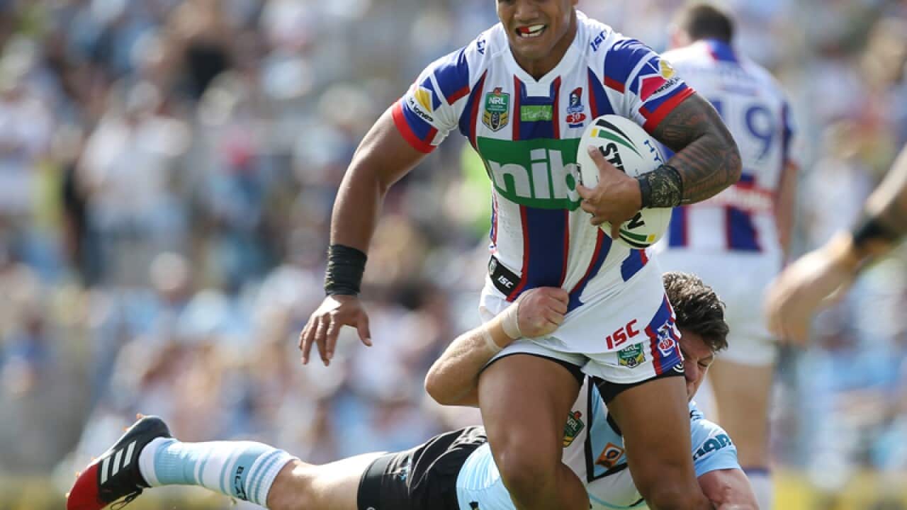Chad Townsend of the Sharks tackles Peter MataÕutia of the Knights