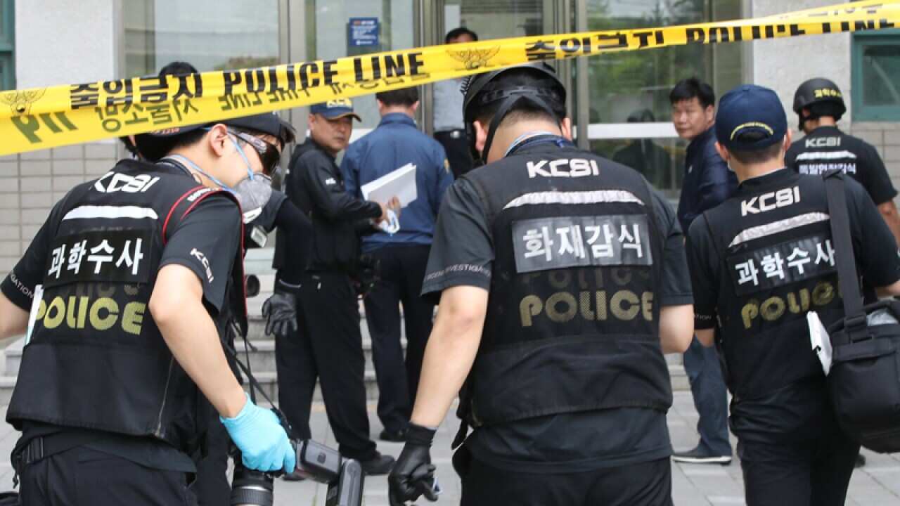 Police investigators at the scene of an explosion at Yonsei University