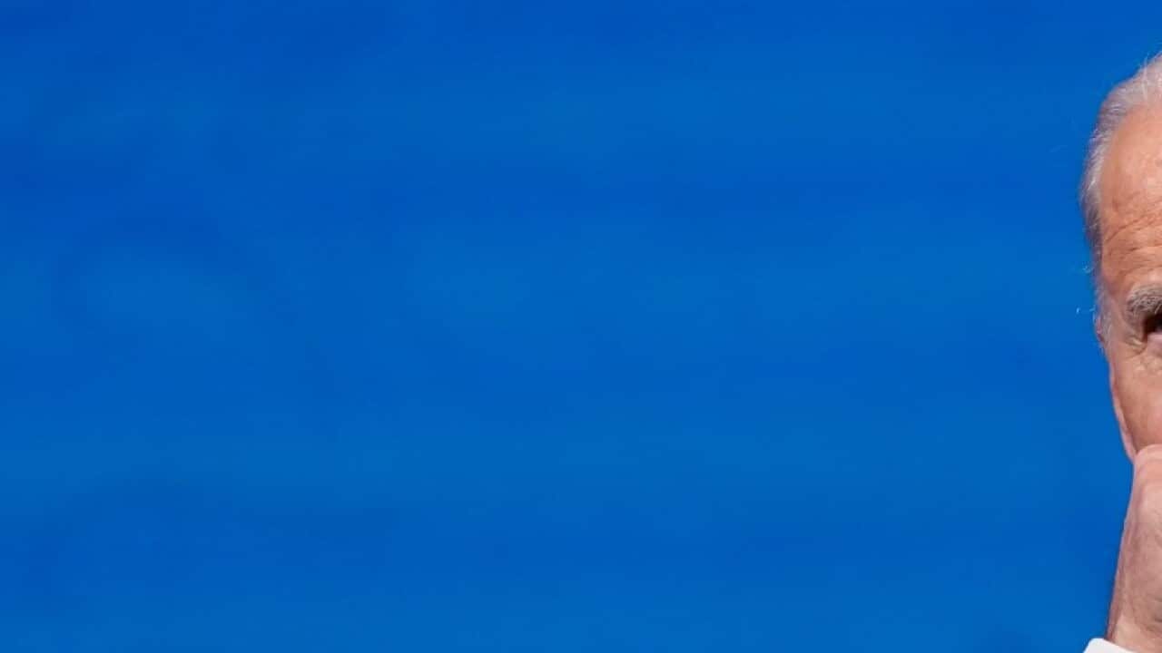 President-elect Joe Biden clears his throat as he speaks after the Electoral College formally elected him as president, Monday, Dec. 14, 2020, at The Queen theater in Wilmington, Del.