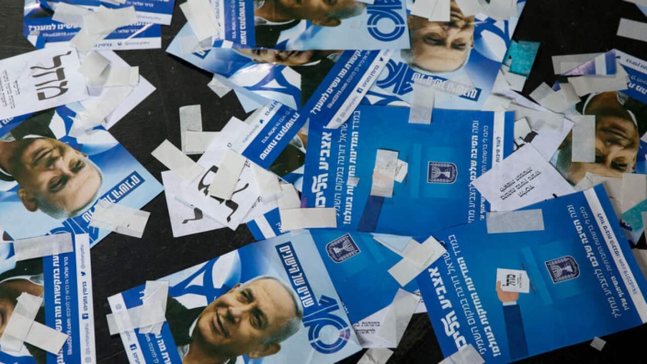 Likud party ballot papers and Israel's Prime Minister Benjamin Netanyahu's campaign fliers are seen on the ground after polls for Israel's general elections closed in Tel Aviv, Israel, Wednesday, April 10, 2019. (AP Photo/Ariel Schalit)