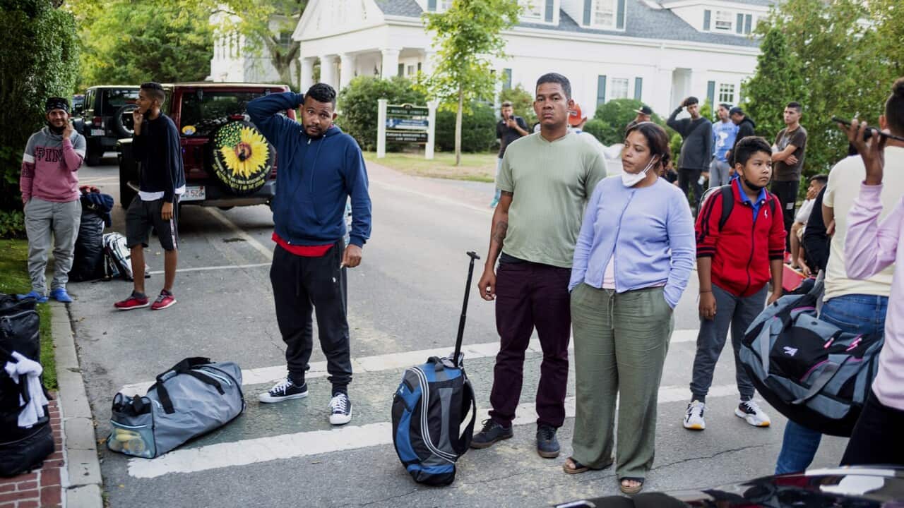 Migrants flown to Martha's Vineyard from Florida gather with their belongings
