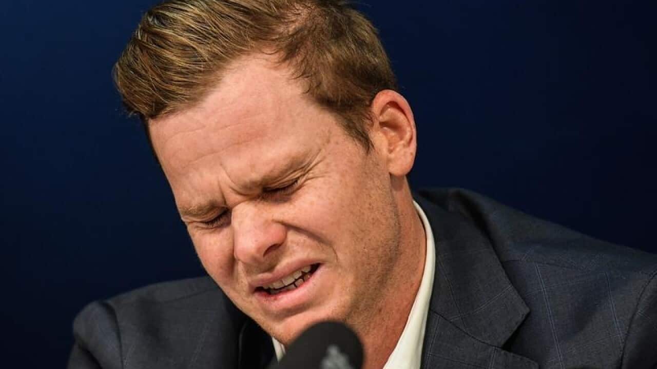 Former Australian captain Steve Smith reacts during a press conference