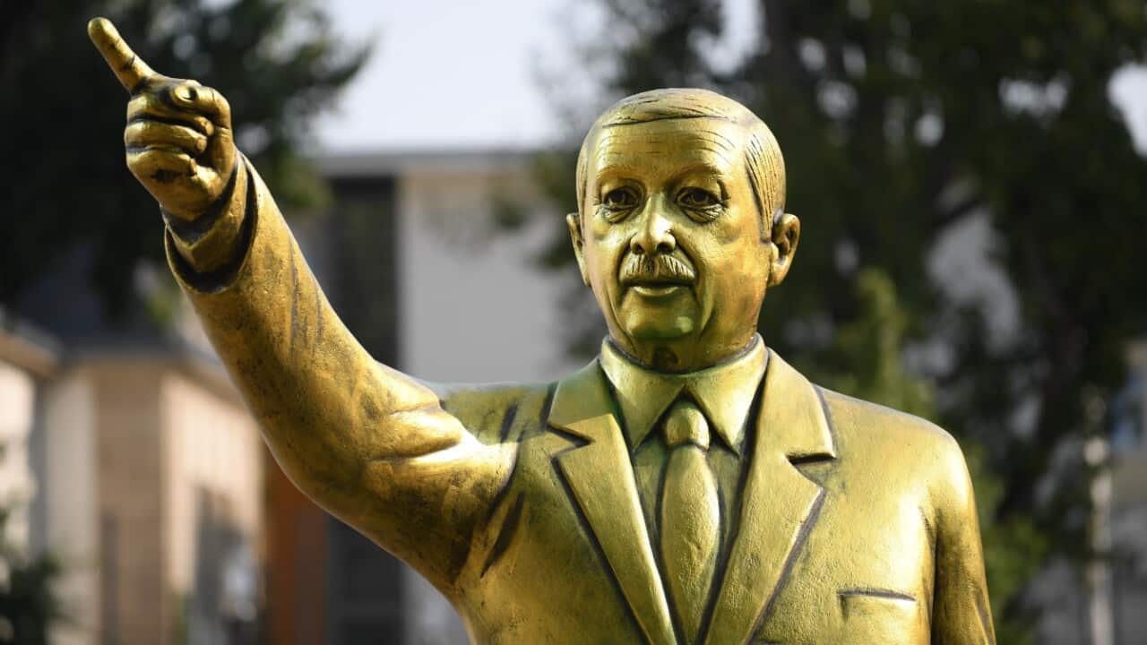 A golden statue of Turkish President Recep Tayyip Erdogan stands on the Square of German Unity in Wiesbaden