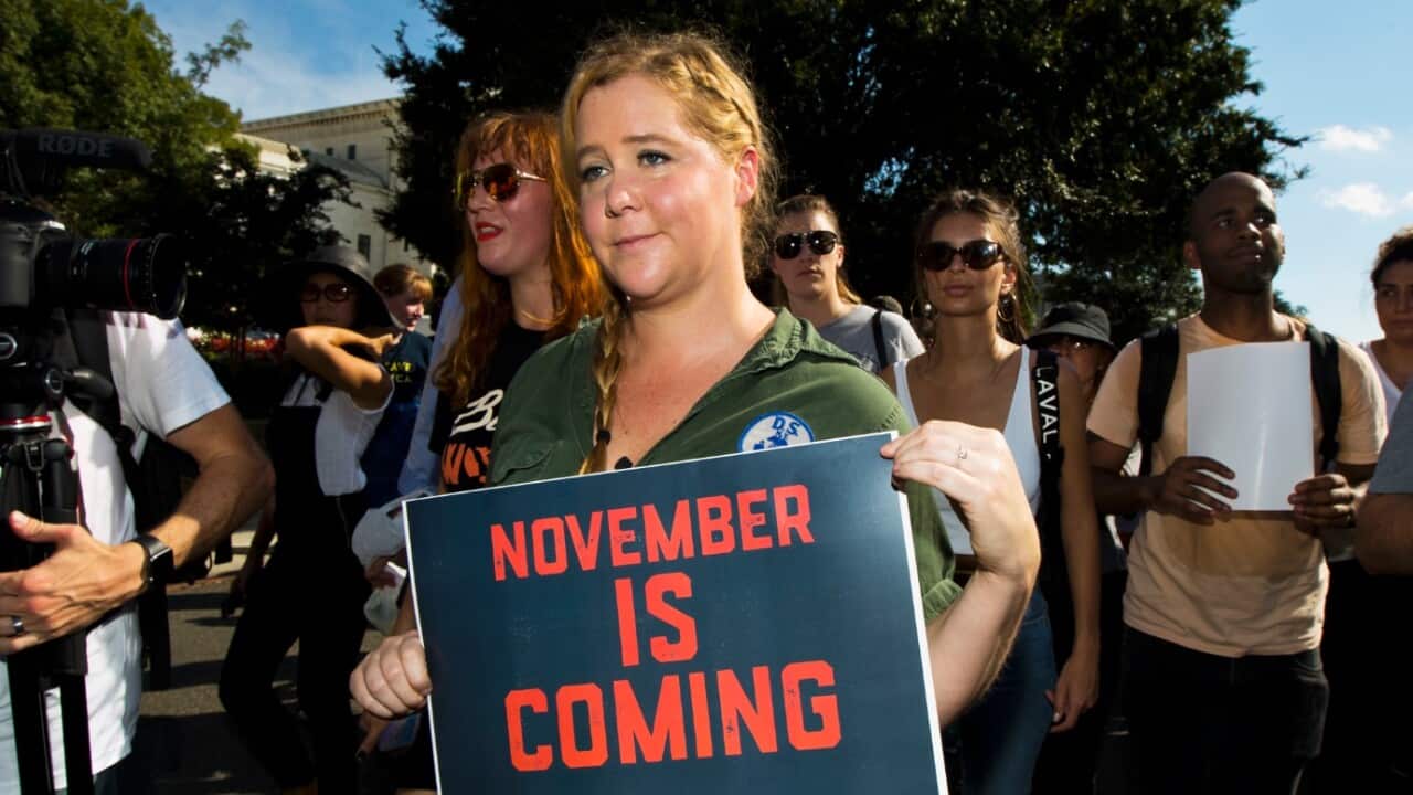 Actress and comedian Amy Schemer joins a march against Supreme Court nominee Brett Kavanaugh from the Supreme Court to the Hart Senate Office Building