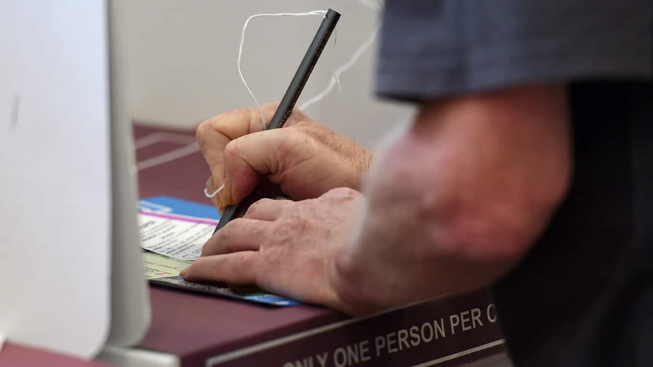 A voter at a polling booth during the Queensland state election