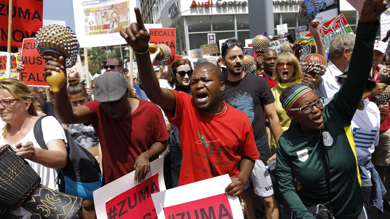 Some of the thousands of people marching against South African President Jacob Zuma after President Zuma fired two finance ministers in the space of last week, in Johannesburg, South Africa, 16 December 2015. (EPA/KIM LUDBROOK)