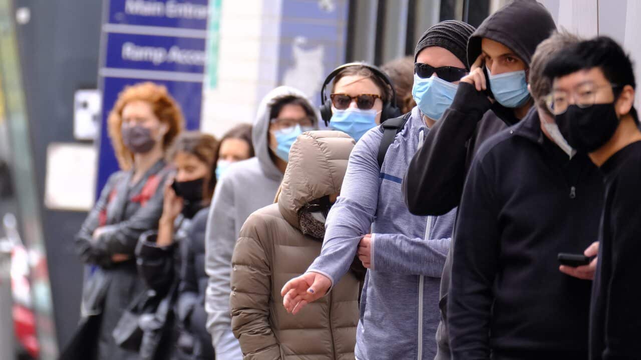 People line up to get tested for Covid-19 outside the Royal Melbourne Hospital in Melbourne, Tuesday, May 25, 2021. (AAP Image/Luis Ascui) NO ARCHIVING