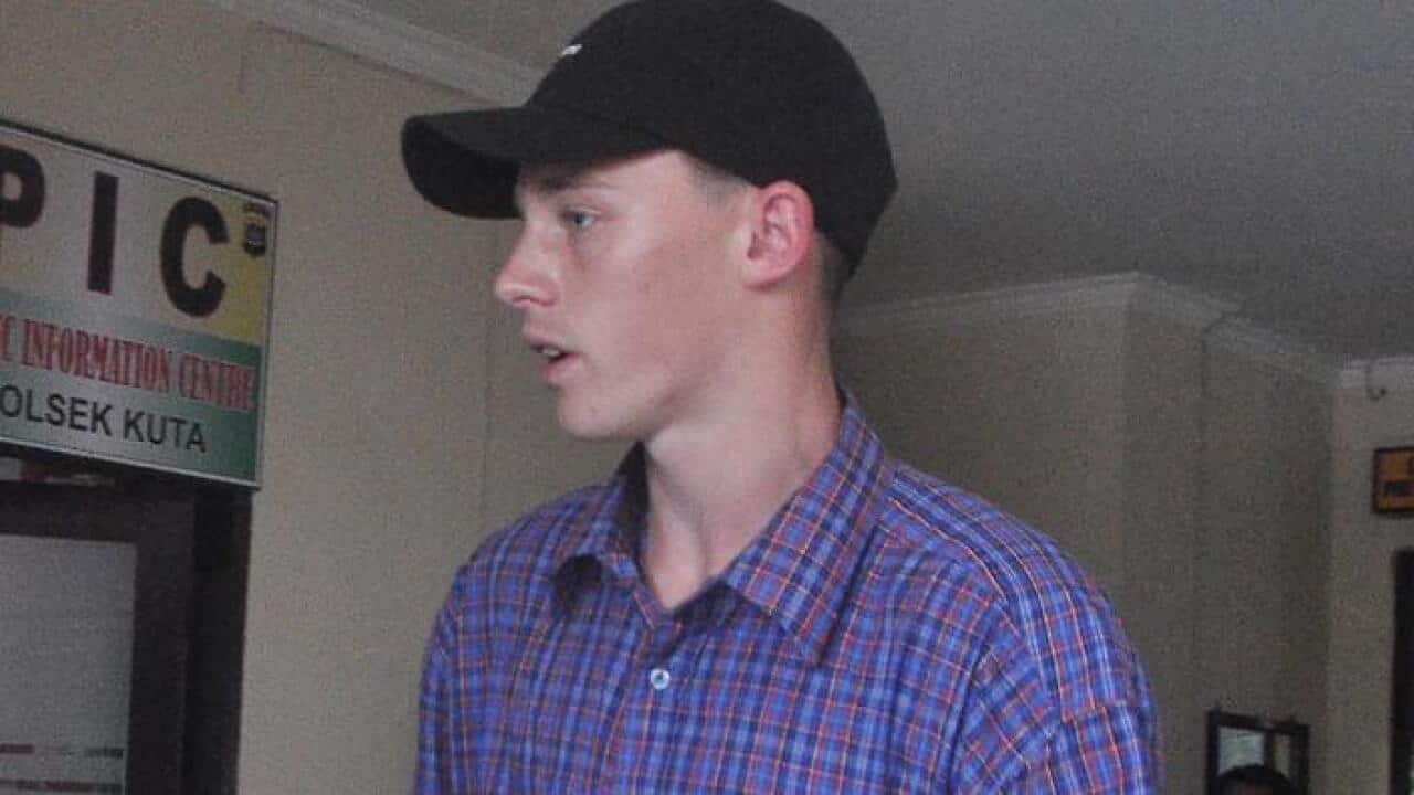 Australian teenager Jamie Murphy is escorted at Kuta police station, Bali, Indonesia, Tuesday, Nov. 22, 2016. The 18-year-old from Perth was detained after he was allegedly found with a suspicious white powder. (AAP Image/Putra Sinulingga) NO ARCHVING