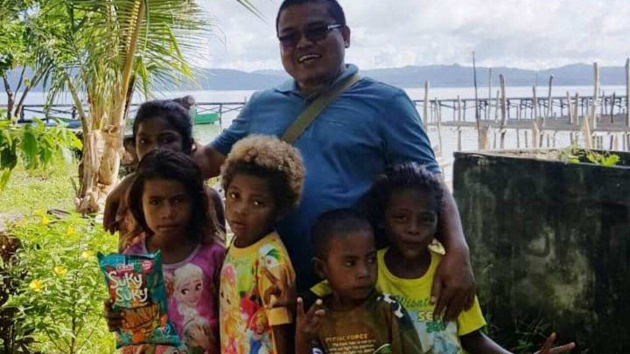 M Fajar Sodik with Papuan's Children
