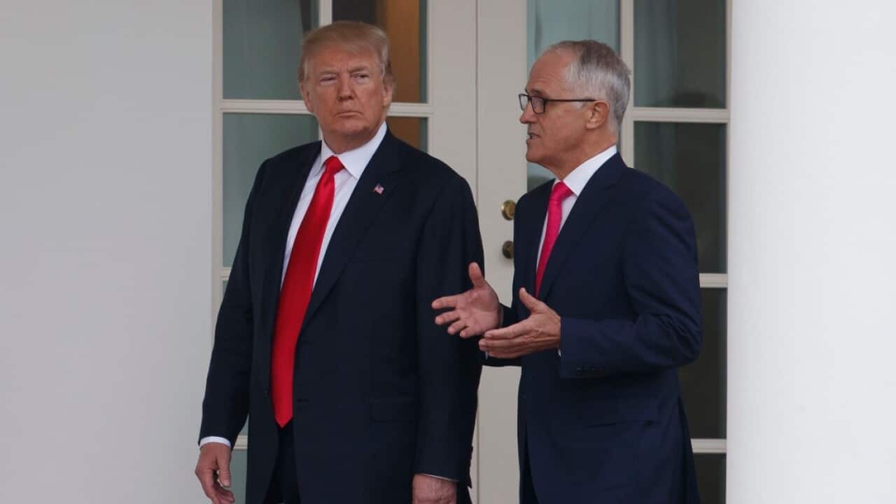 President Donald Trump and Australian Prime Minister Malcolm Turnbull walk along the colonnade to the Oval Office of the White House