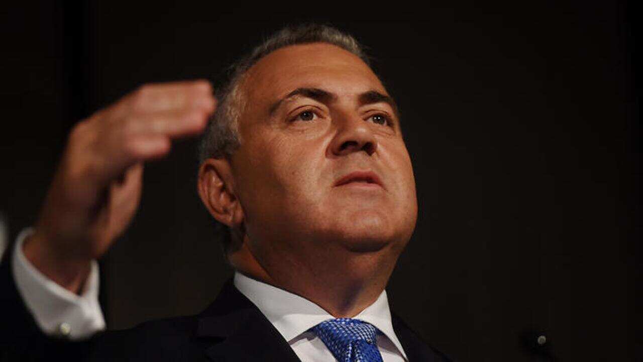 Federal Treasurer Joe Hockey addresses the Sydney Business Chamber?s Economic Briefing Breakfast in Sydney, Thursday, Feb. 19, 2015.  (AAP Image/Dean Lewins) NO ARCHIVING