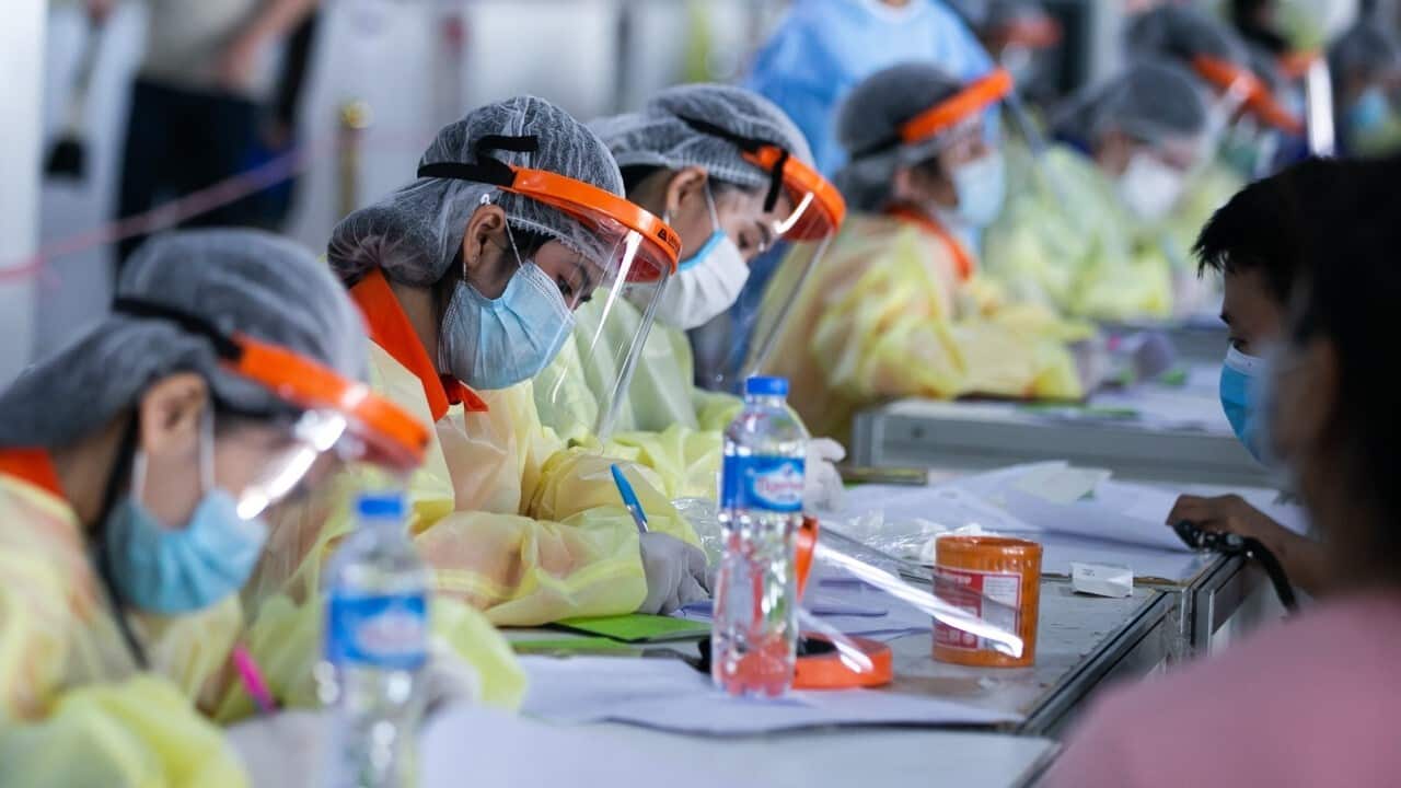 People register for China's Sinopharm COVID-19 vaccines at a vaccination center in Vientiane, Laos, June 17, 2021 (Kaikeo Saiyasane-Xinhua via Getty Images).jpg