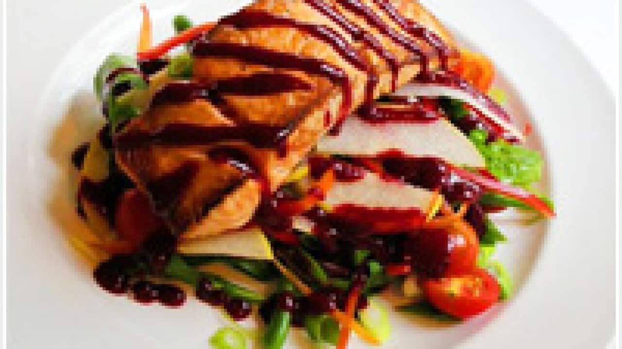 Salmon steak with pancetta, roquette and nashi pear