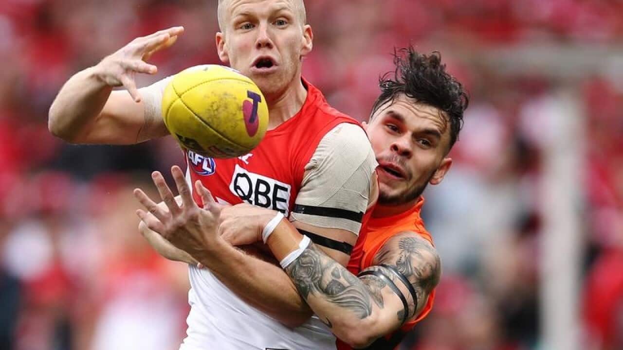 Zac Williams of the Giants (right).