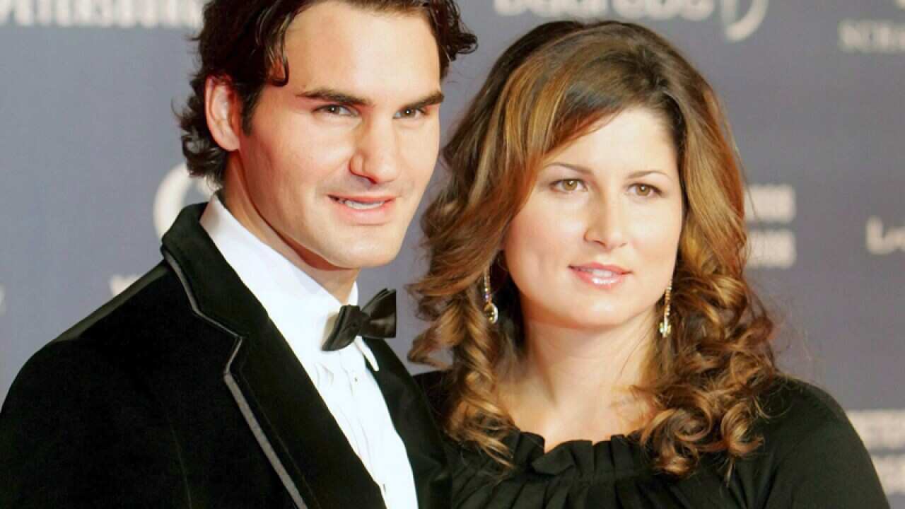 Swiss tennis player Roger Federer (L) and Mirka Vavrinec